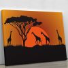 Silhouettes of giraffes in safari sunset Canvas Print or Poster